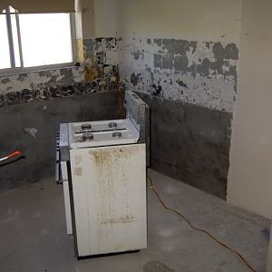 Nundah unit reno - kitchen gutted (view from hallway)